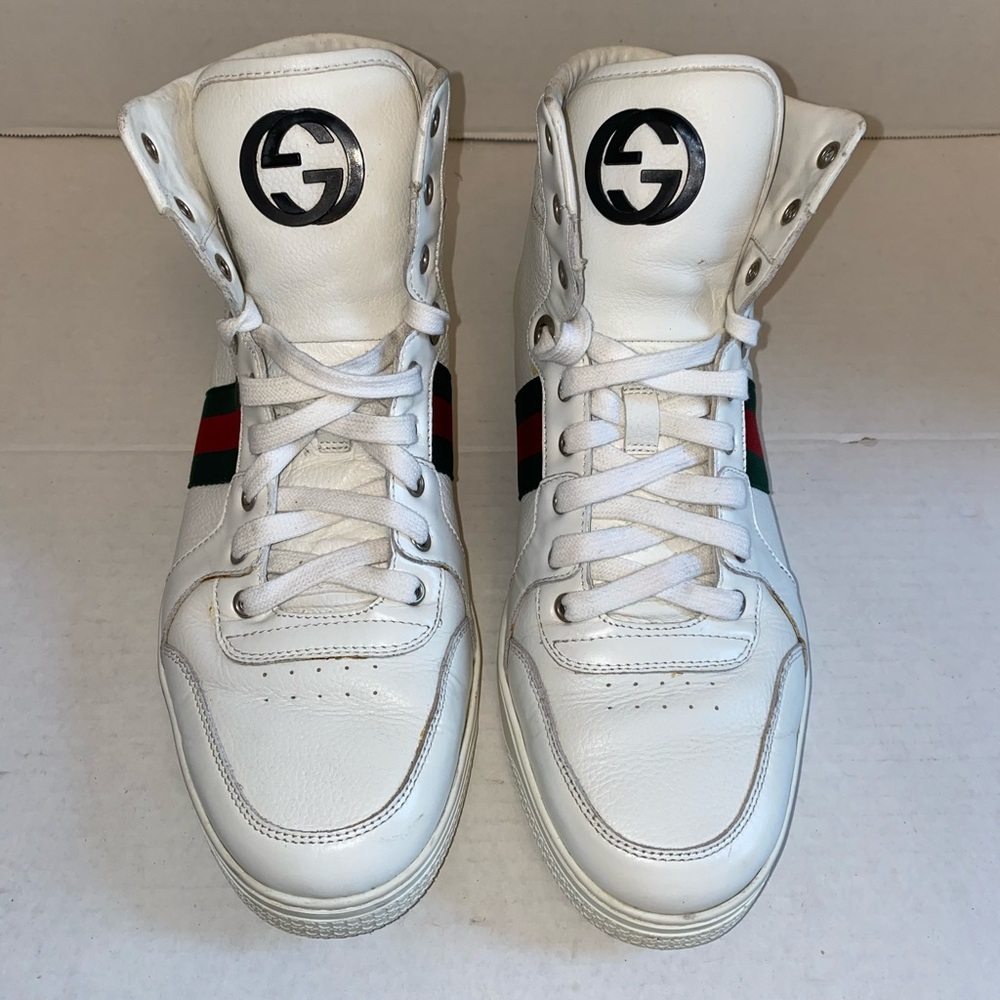 Gucci Gg white high top sneakers.